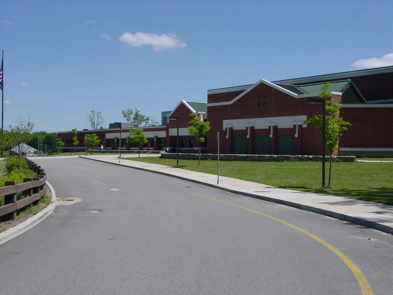 Dartmouth High School on Bakerville Road, a red brick building with green roofs beside the main drive