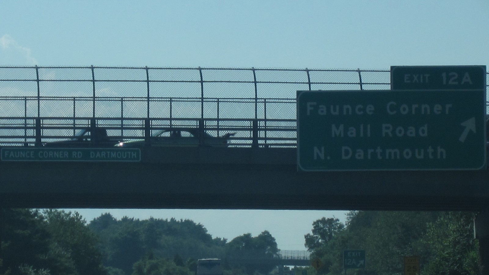 Interstate 195 westbound in Dartmouth at the Faunce Corner Road overpass, with its bridge sign reading Faunce Corner Rd Dartmouth and a green Exit 12A sign for Faunce Corner Mall Road and North Dartmouth