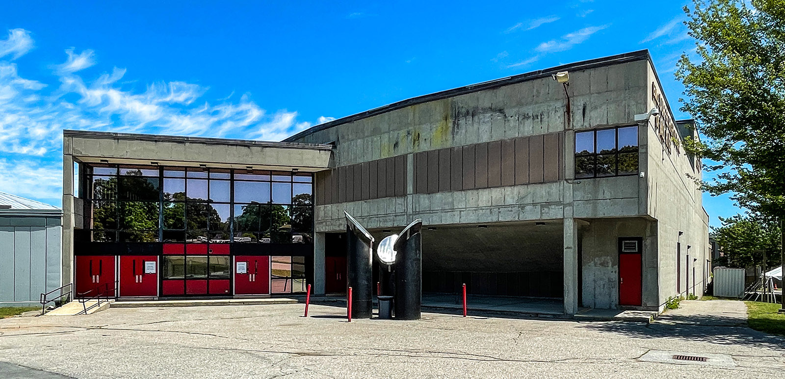 The 1978 B.M.C. Durfee High School building in Fall River, concrete with red doors