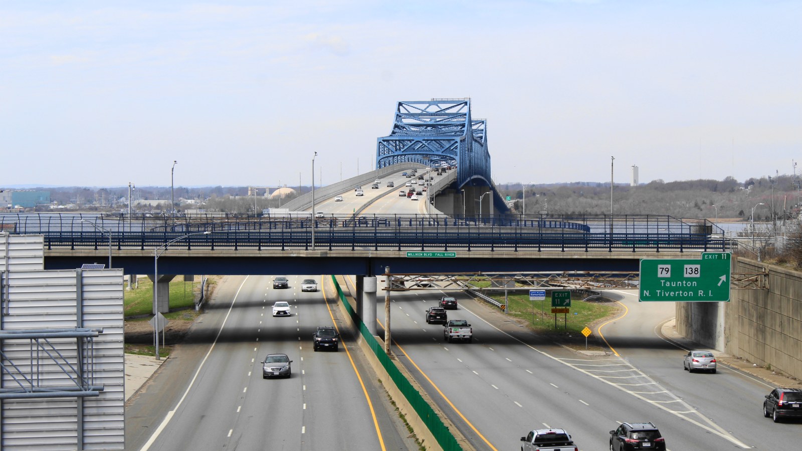 Interstate 195 in Fall River, with the Route 79 and Route 138 exit sign and the Braga Bridge behind