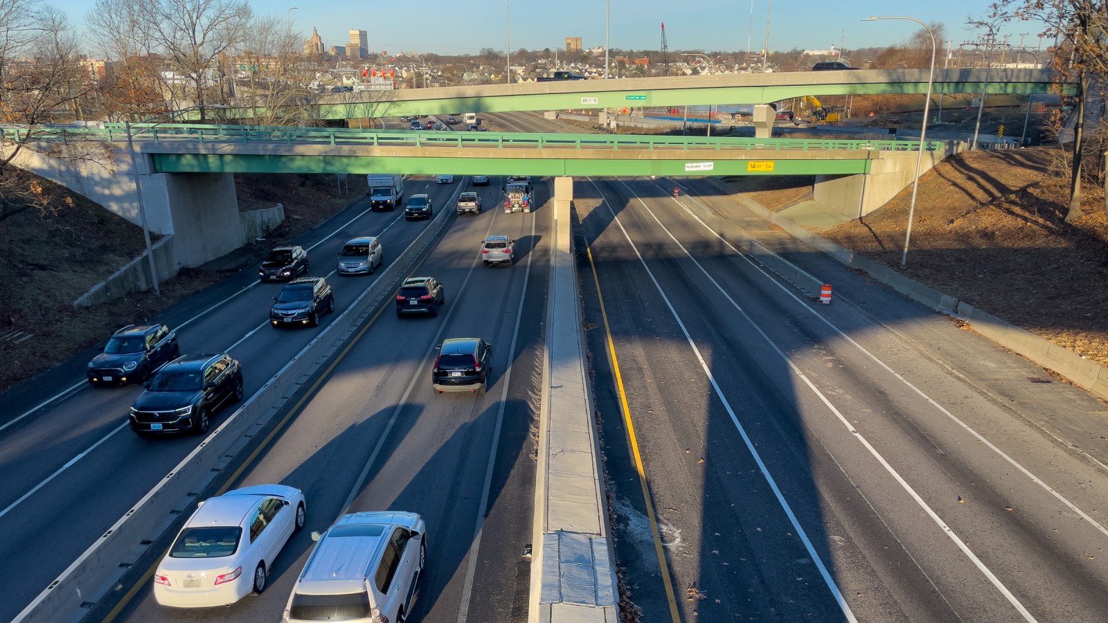 Interstate 195 in East Providence seen from the Potter Street overpass, looking west toward the Providence skyline, with green overpasses and a Taunton Avenue exit sign