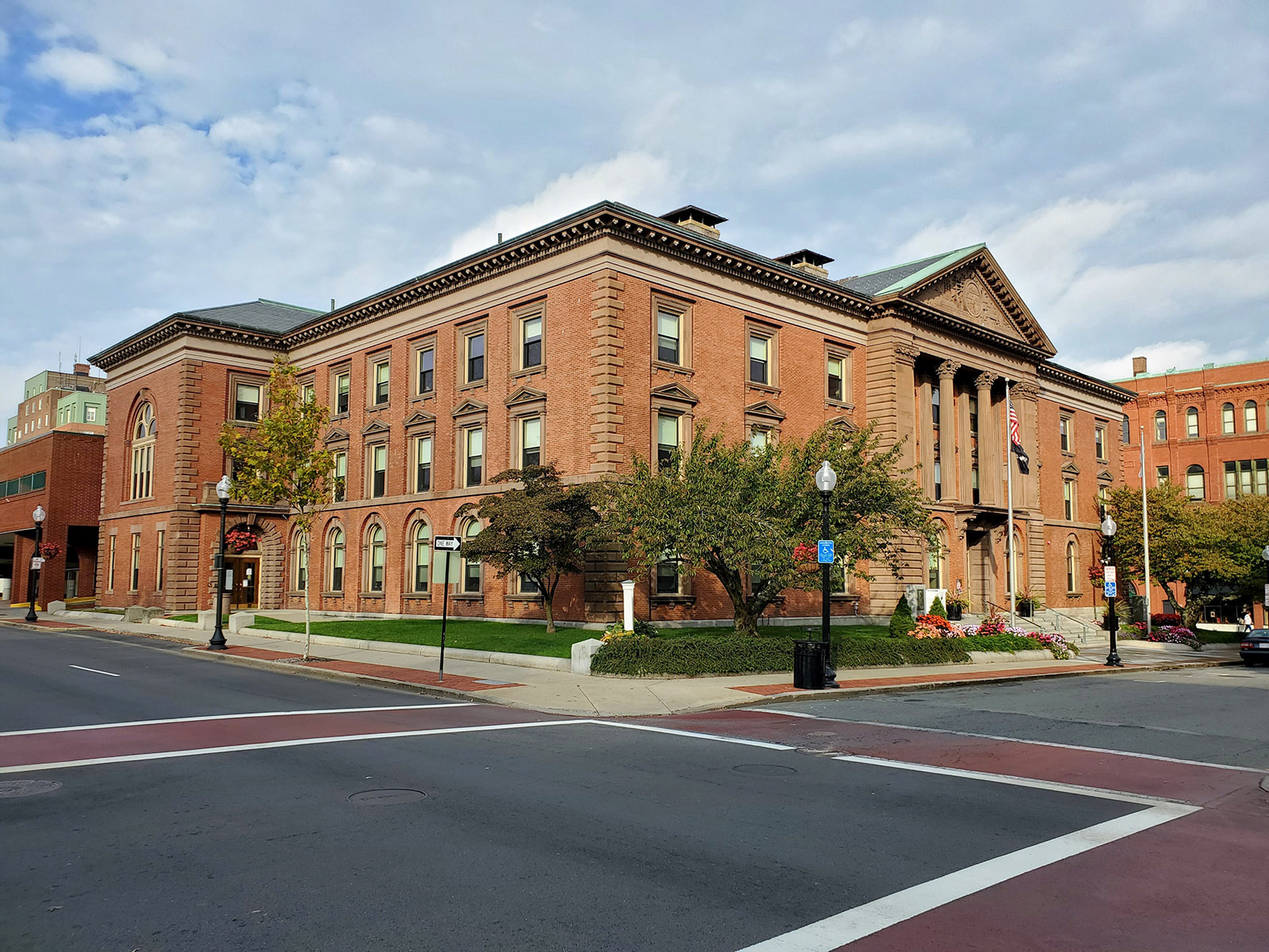 New Bedford City Hall, a red brick building with a columned entrance, on a fall afternoon