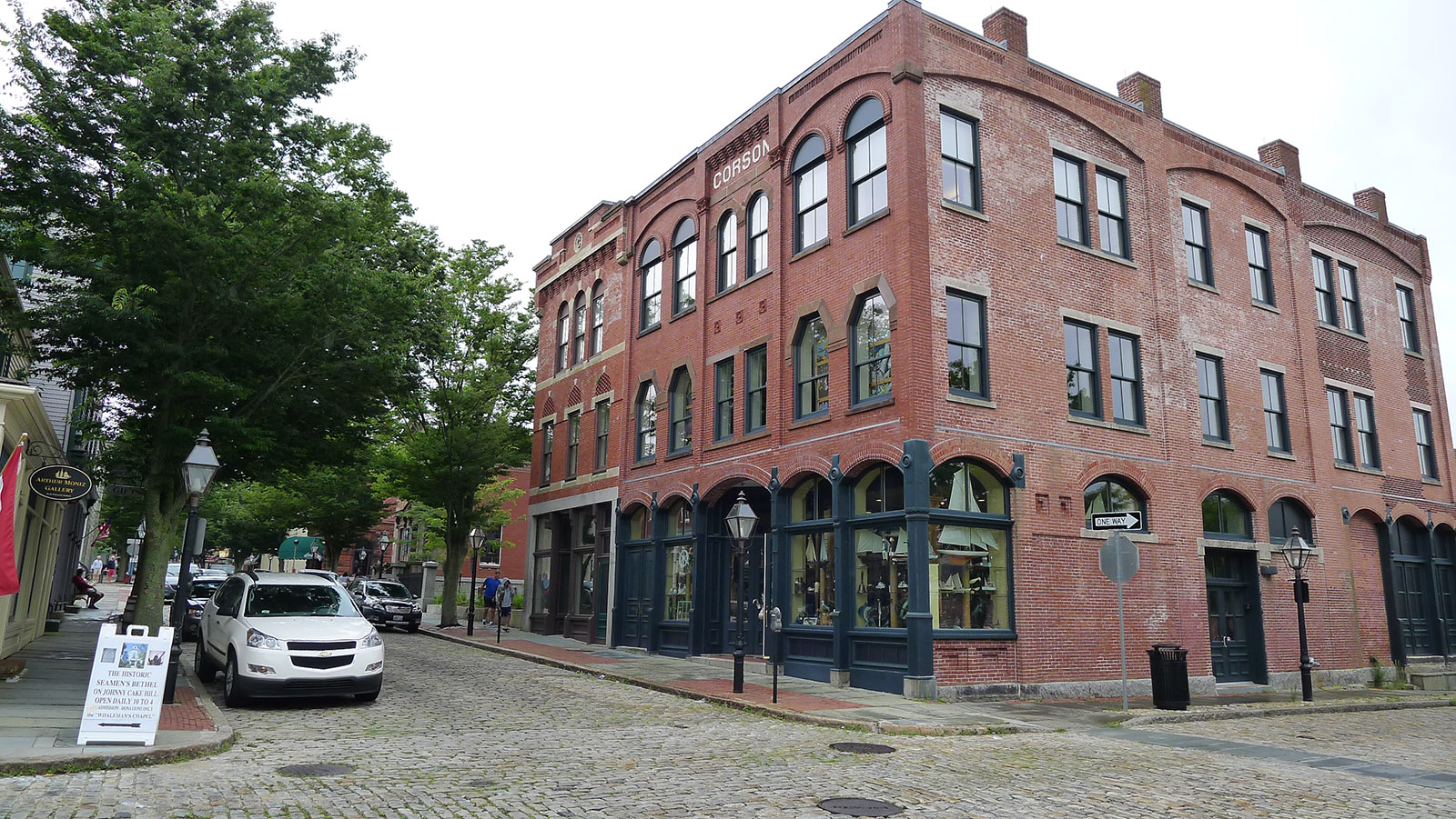 A brick building on a cobblestone street in downtown New Bedford