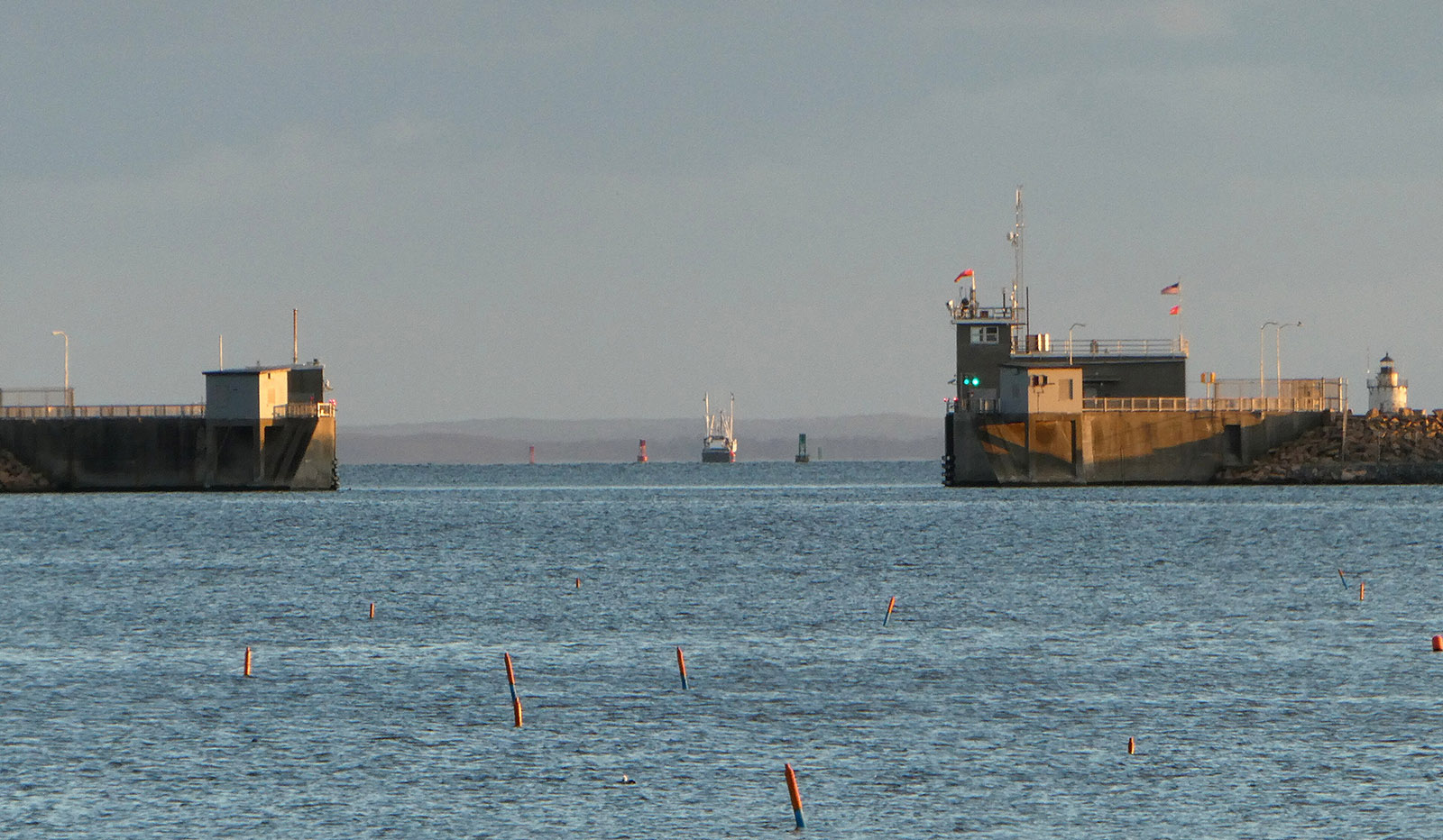The two sides of the New Bedford Hurricane Barrier across the harbor entrance