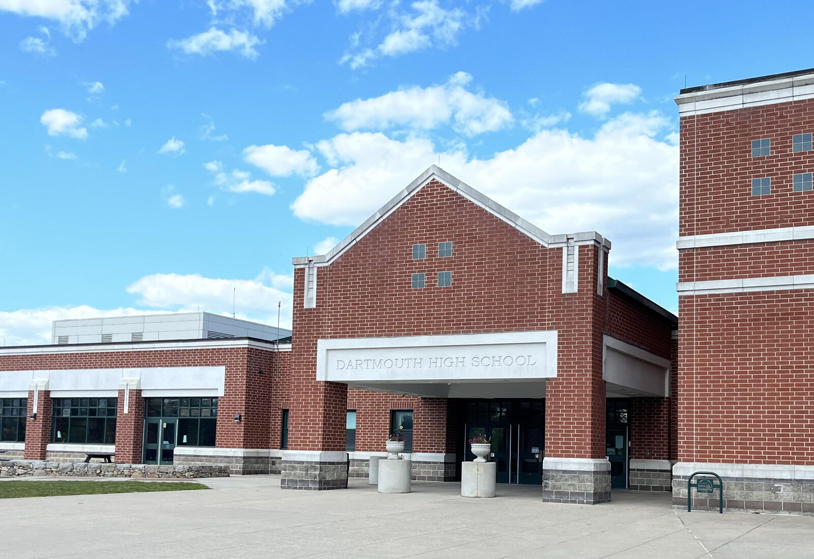 The entrance of Dartmouth High School, brick with a gabled front