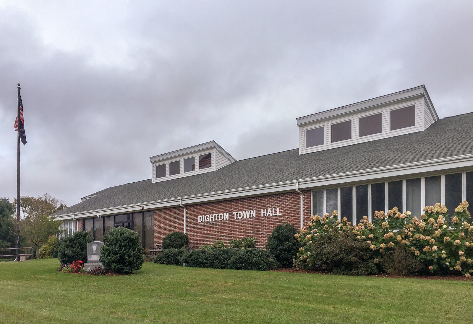 Dighton Town Hall, a low red brick building with its name on the front
