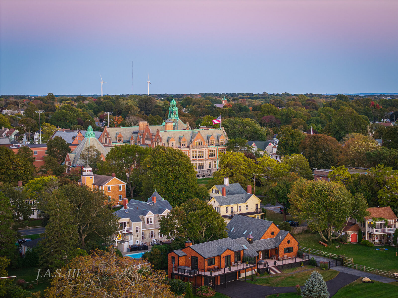 Fairhaven High School's towers among fall trees, seen from the air