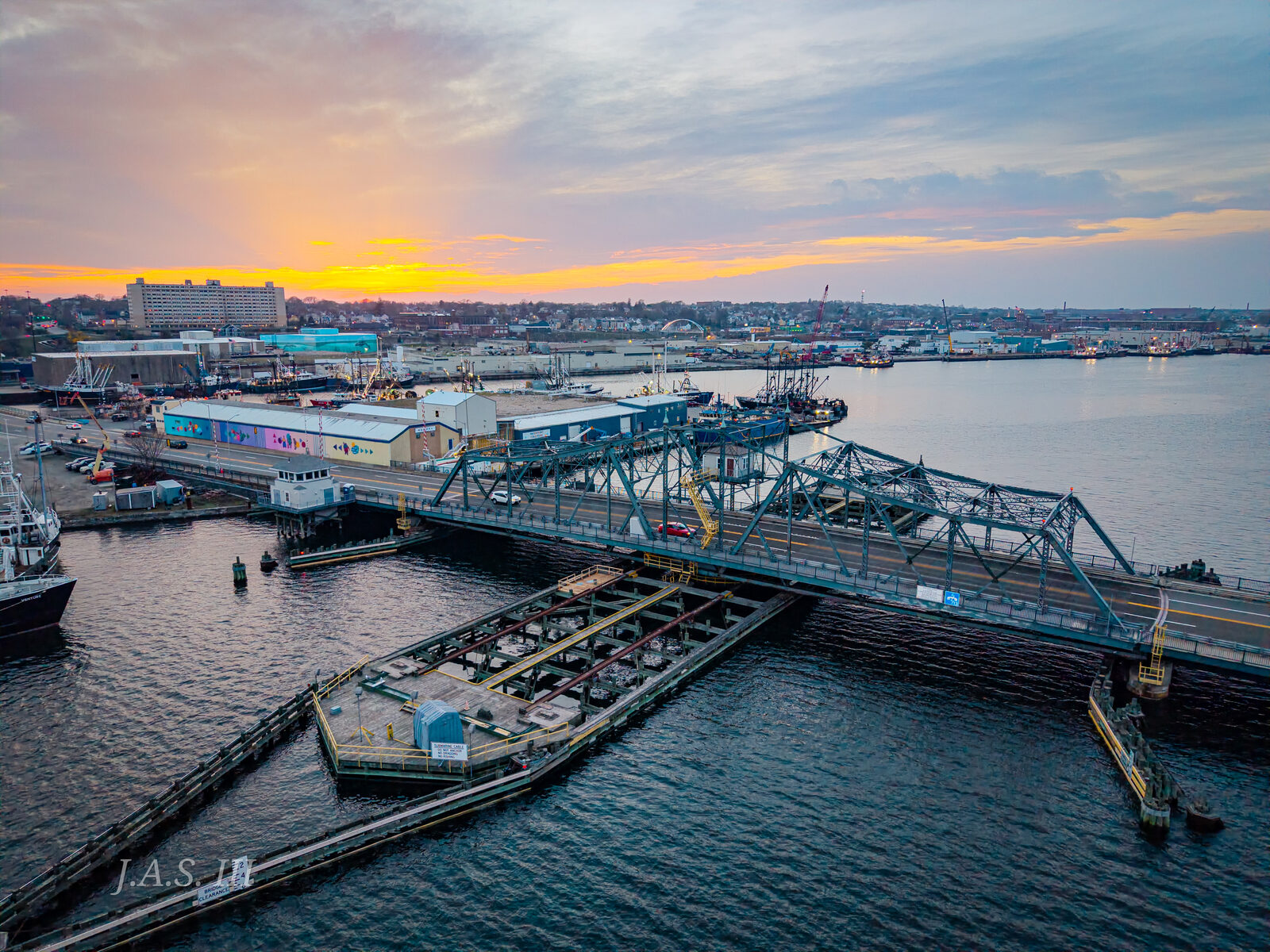 The New Bedford-Fairhaven swing bridge and State Pier from the air at sunset