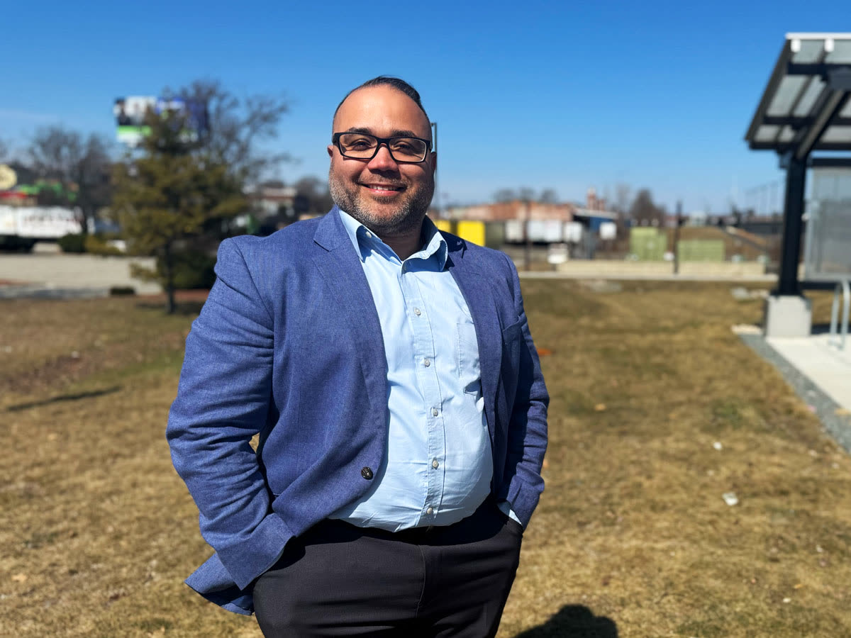 Shawn Oliver, the Republican nominee for lieutenant governor, standing outdoors in a blue jacket, in a campaign photo